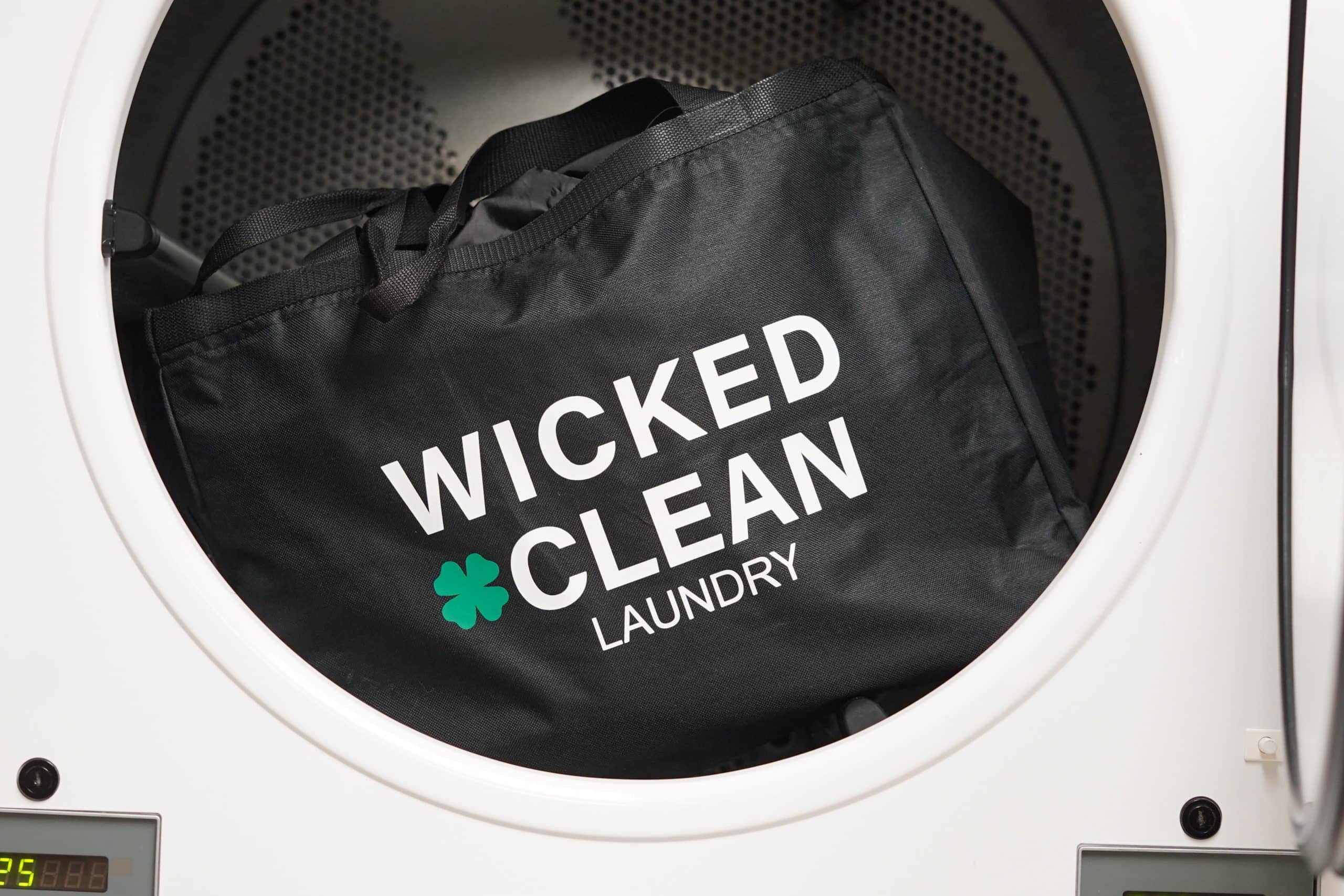 Wicked clean laundry bag inside washing machine — boston laundry pickup service